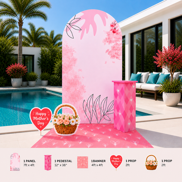 Decorative setup with pink arch, pedestal, and props in a poolside setting