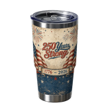 Tumbler with '250 Years Strong' design featuring American flag and fireworks on a beige and blue background.