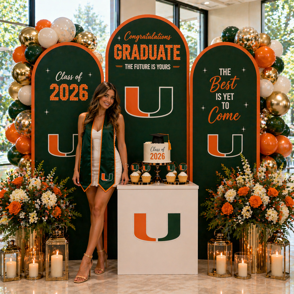 Graduation celebration with 'Congratulations Graduate' sign, balloons, and floral decorations.